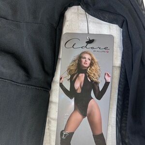 Never worn black sheer turtleneck with deep V-neck plunge, long sleeve, bodysuit